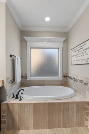 a bathroom with a bathtub and a sink