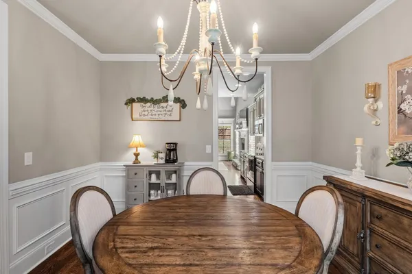 a view of a dining room with furniture and window