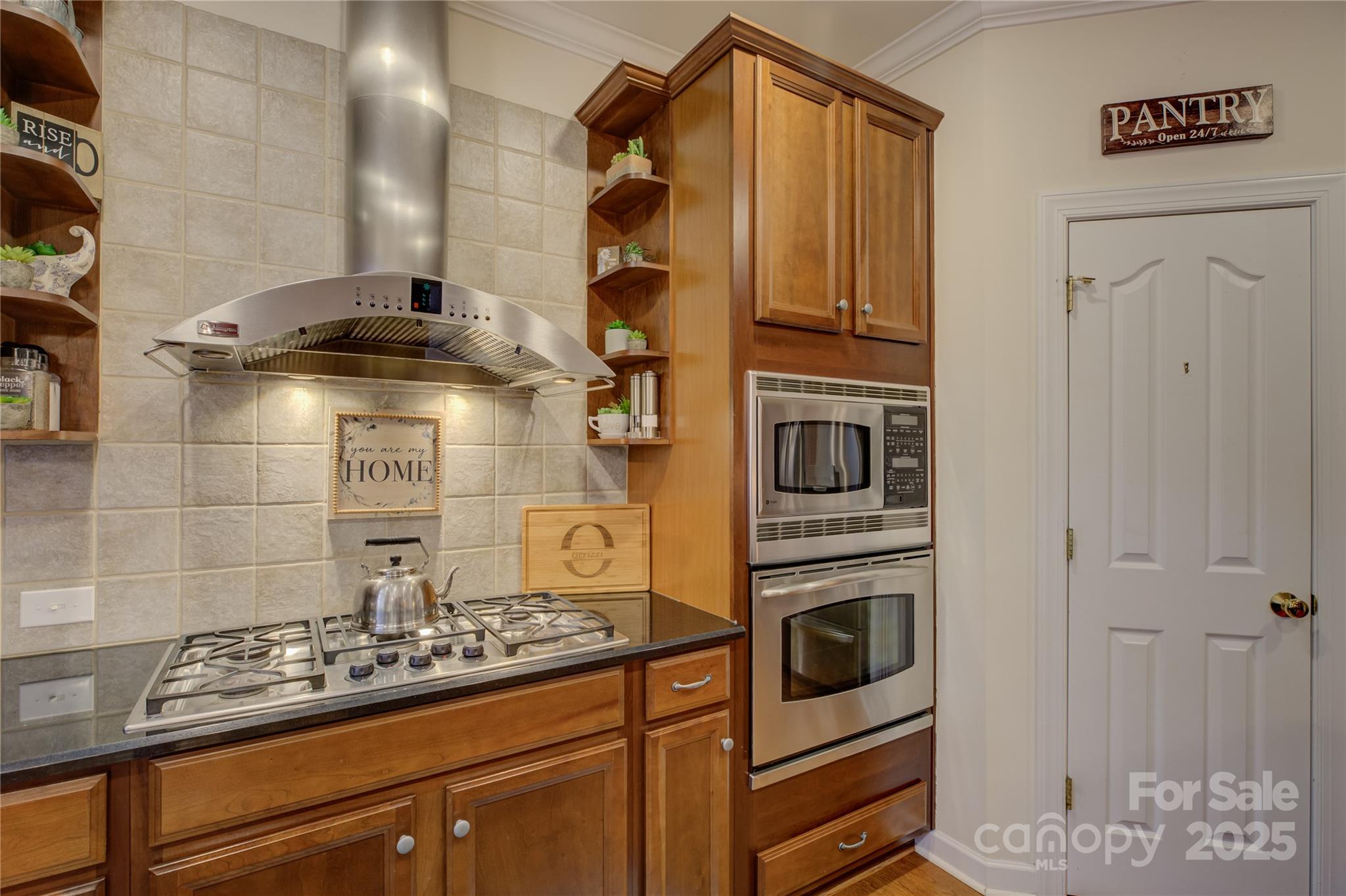 16645 Turtle Point Road Charlotte, NC 28278 - Photo 18 of 48 a kitchen with a refrigerator and stove