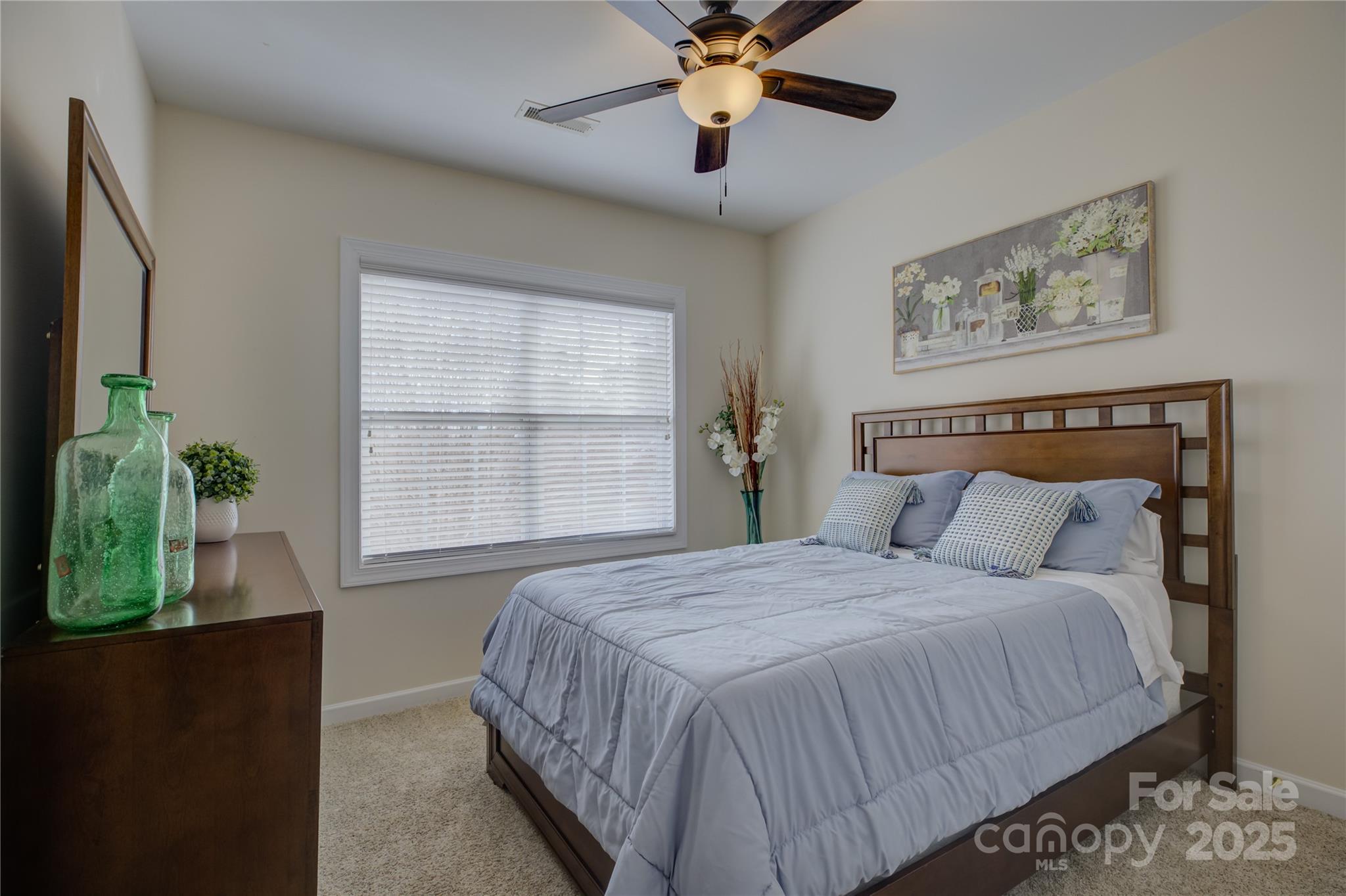 16645 Turtle Point Road Charlotte, NC 28278 - Photo 32 of 48 a bedroom with a bed and a window