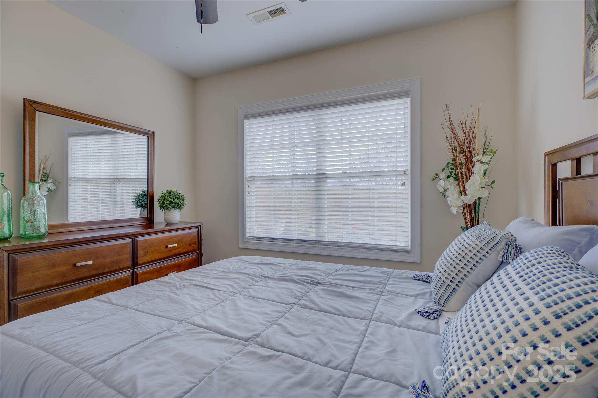 16645 Turtle Point Road Charlotte, NC 28278 - Photo 33 of 48 a bedroom with a bed and a large window