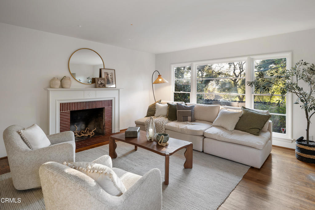 3624 Canyon Crest Road Altadena, CA 91001 - Photo 14 of 57 a living room with furniture a large window and a fireplace