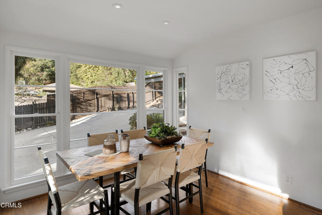 3624 Canyon Crest Road Altadena, CA 91001 - Photo 17 of 57 a view of a dining room with furniture window and wooden floor
