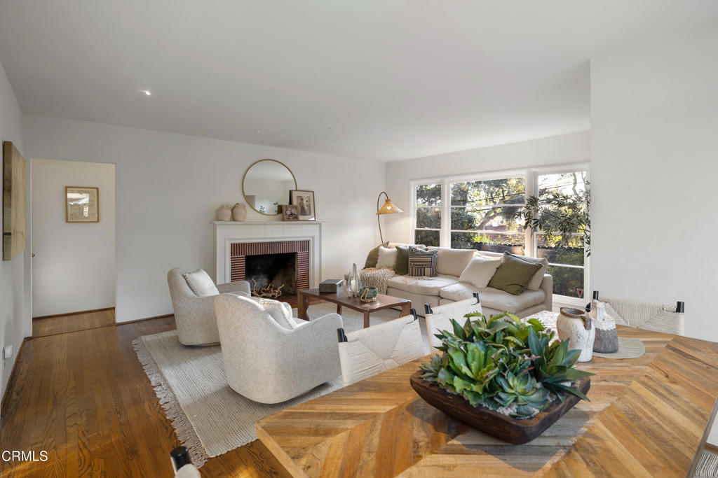 3624 Canyon Crest Road Altadena, CA 91001 - Photo 19 of 57 a living room with furniture fireplace and a window