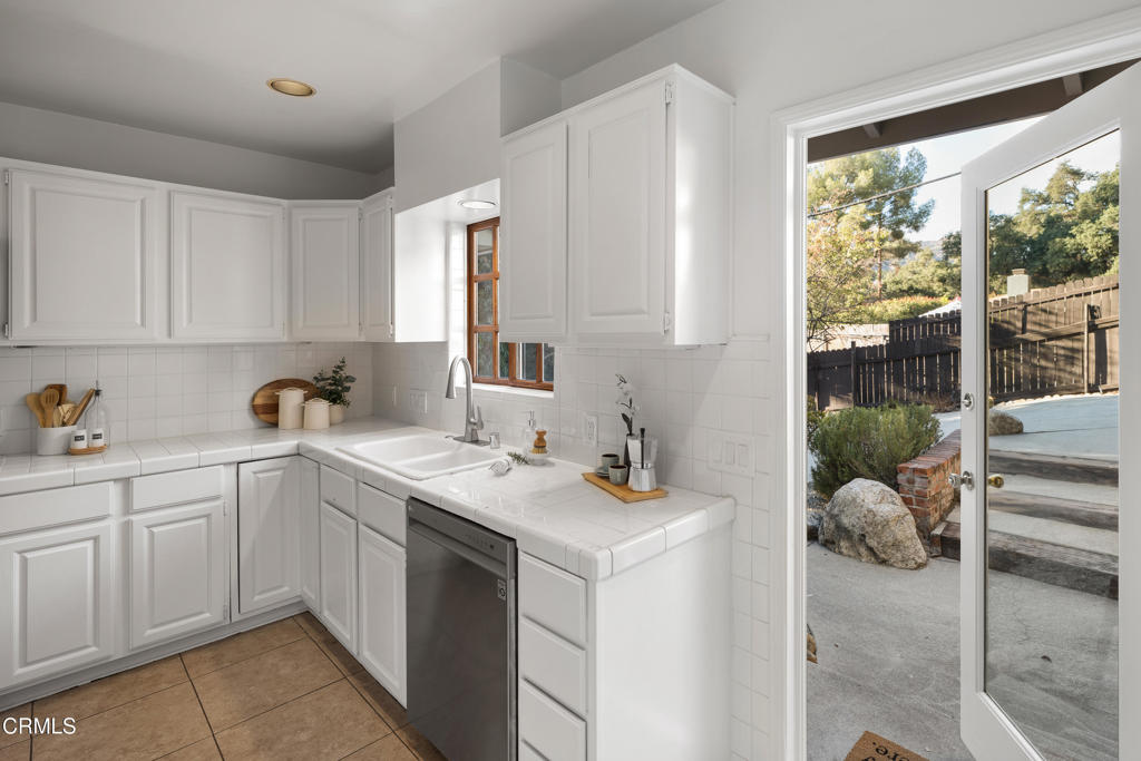 3624 Canyon Crest Road Altadena, CA 91001 - Photo 25 of 57 a kitchen with a sink and cabinets