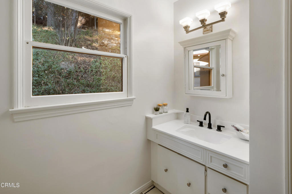 3624 Canyon Crest Road Altadena, CA 91001 - Photo 32 of 57 a bathroom with a sink and a mirror