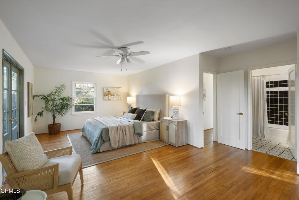 3624 Canyon Crest Road Altadena, CA 91001 - Photo 34 of 57 a spacious bedroom with a bed and ceiling fan