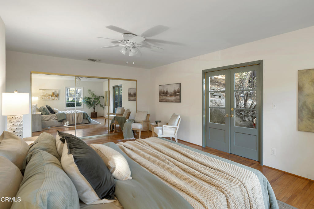 3624 Canyon Crest Road Altadena, CA 91001 - Photo 37 of 57 a large bedroom with a large bed and windows