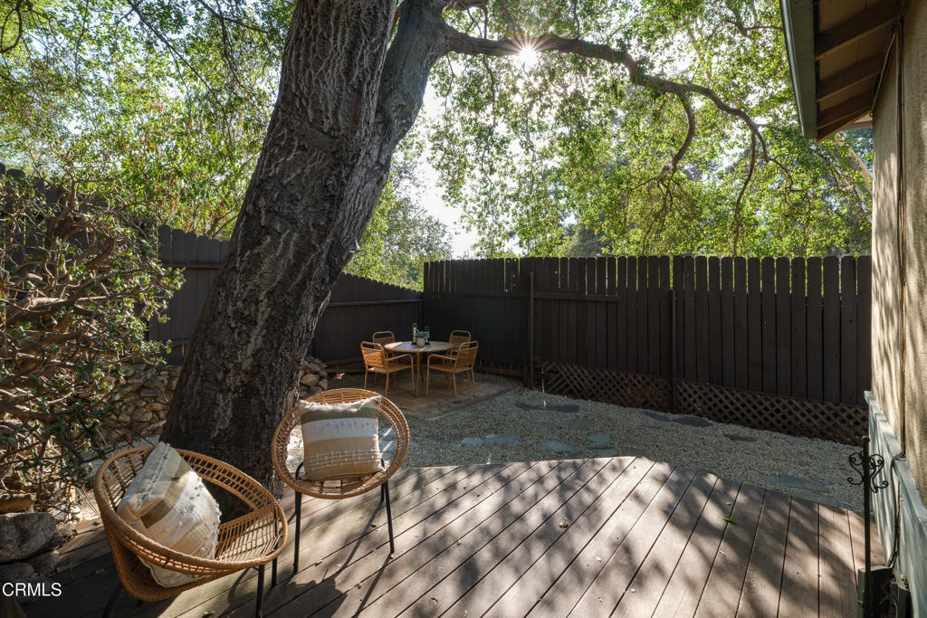3624 Canyon Crest Road Altadena, CA 91001 - Photo 38 of 57 a backyard of a house with table and chairs