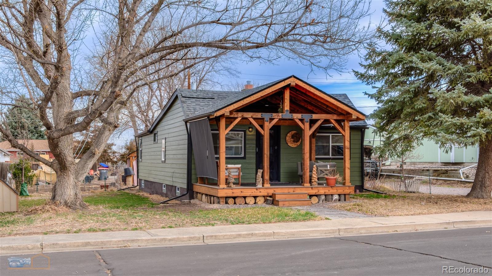 329 2nd Street Frederick, CO 80530 - Photo 1 of 49 a front view of a house with a yard