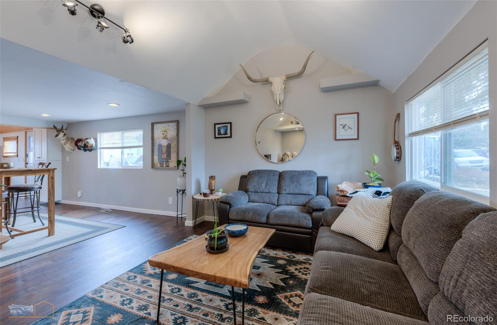 329 2nd Street Frederick, CO 80530 - Photo 14 of 49 a living room with furniture wooden floor and a large window