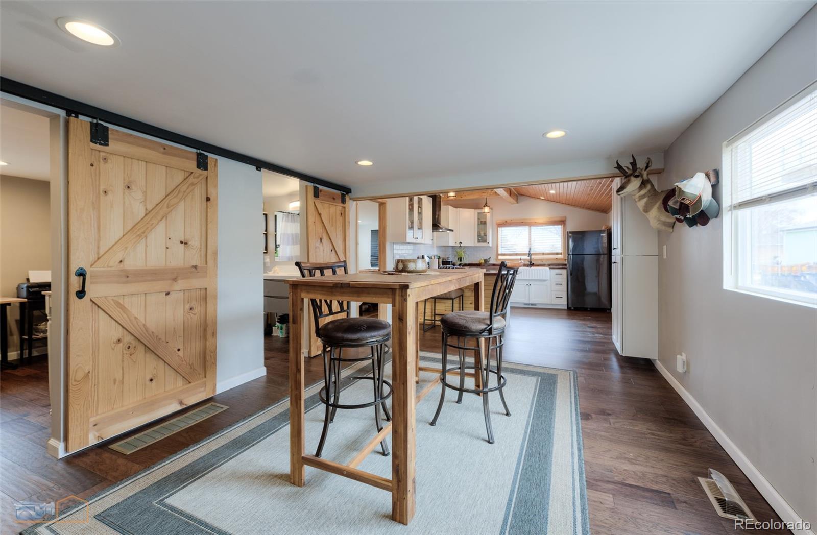 329 2nd Street Frederick, CO 80530 - Photo 15 of 49 a dining area with furniture and a large window
