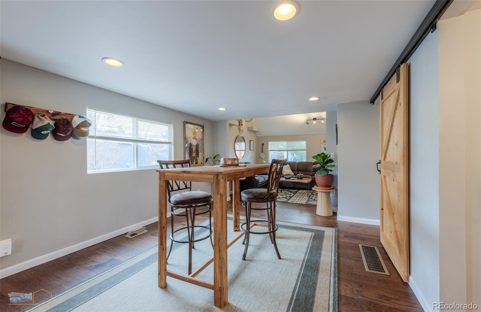329 2nd Street Frederick, CO 80530 - Photo 16 of 49 a view of a dining room with furniture window and wooden floor