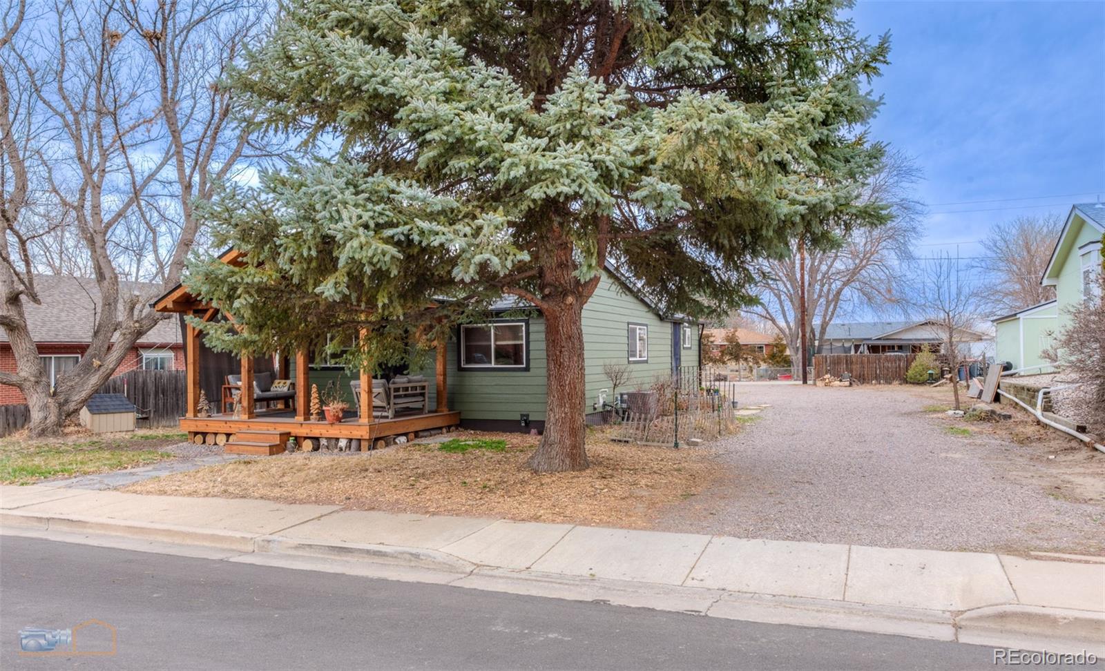 329 2nd Street Frederick, CO 80530 - Photo 2 of 49 a row of palm trees in front of a house