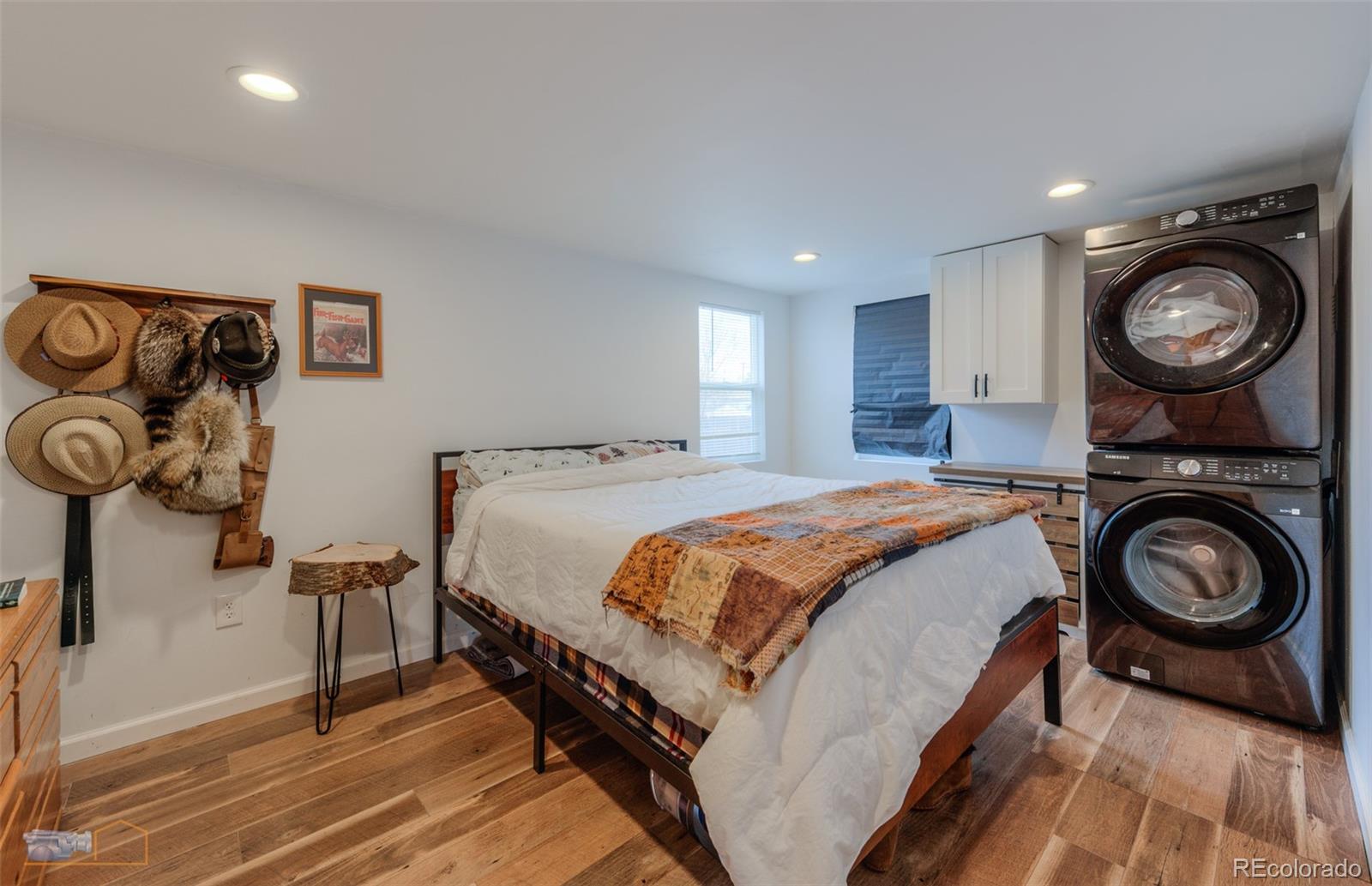 329 2nd Street Frederick, CO 80530 - Photo 22 of 49 a spacious bedroom with a bed and a sink