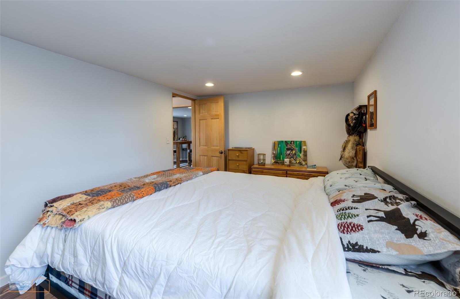 329 2nd Street Frederick, CO 80530 - Photo 23 of 49 a bedroom with a bed and a lamp