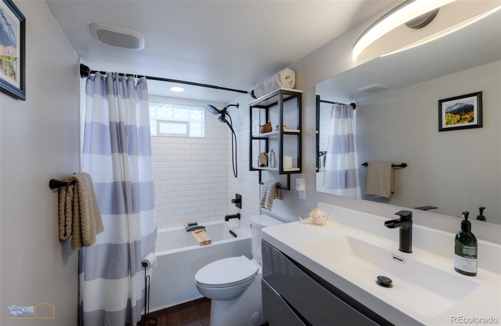 329 2nd Street Frederick, CO 80530 - Photo 24 of 49 a bathroom with a sink toilet and shower