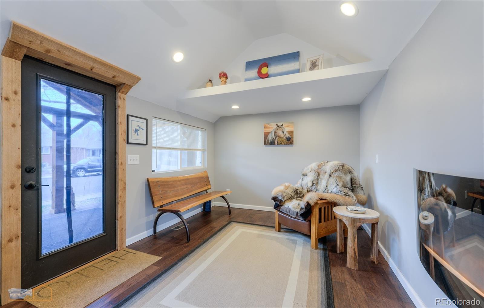 329 2nd Street Frederick, CO 80530 - Photo 36 of 49 a living room with furniture and a wooden floor