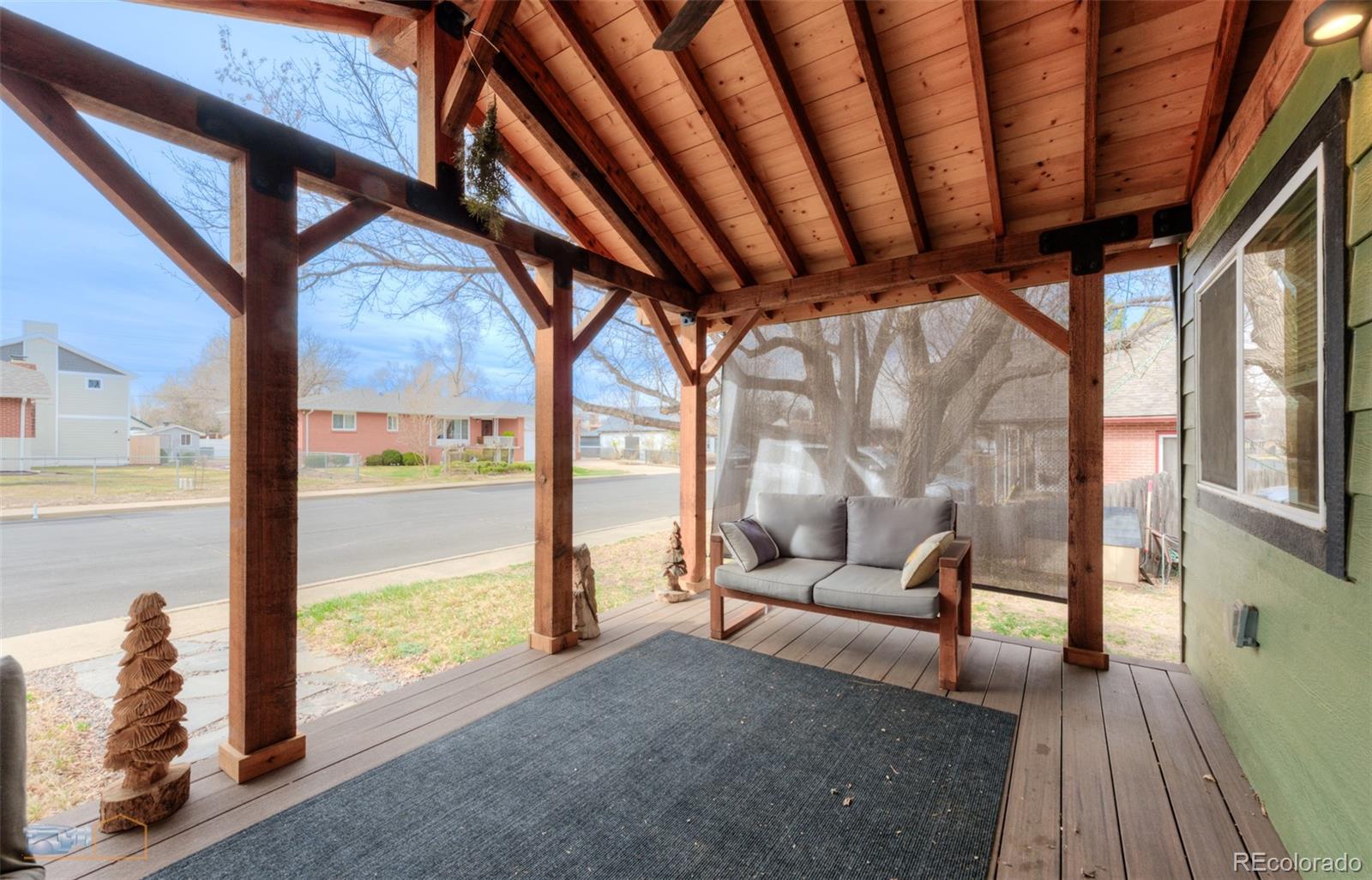 329 2nd Street Frederick, CO 80530 - Photo 38 of 49 a living room with furniture and a floor to ceiling window
