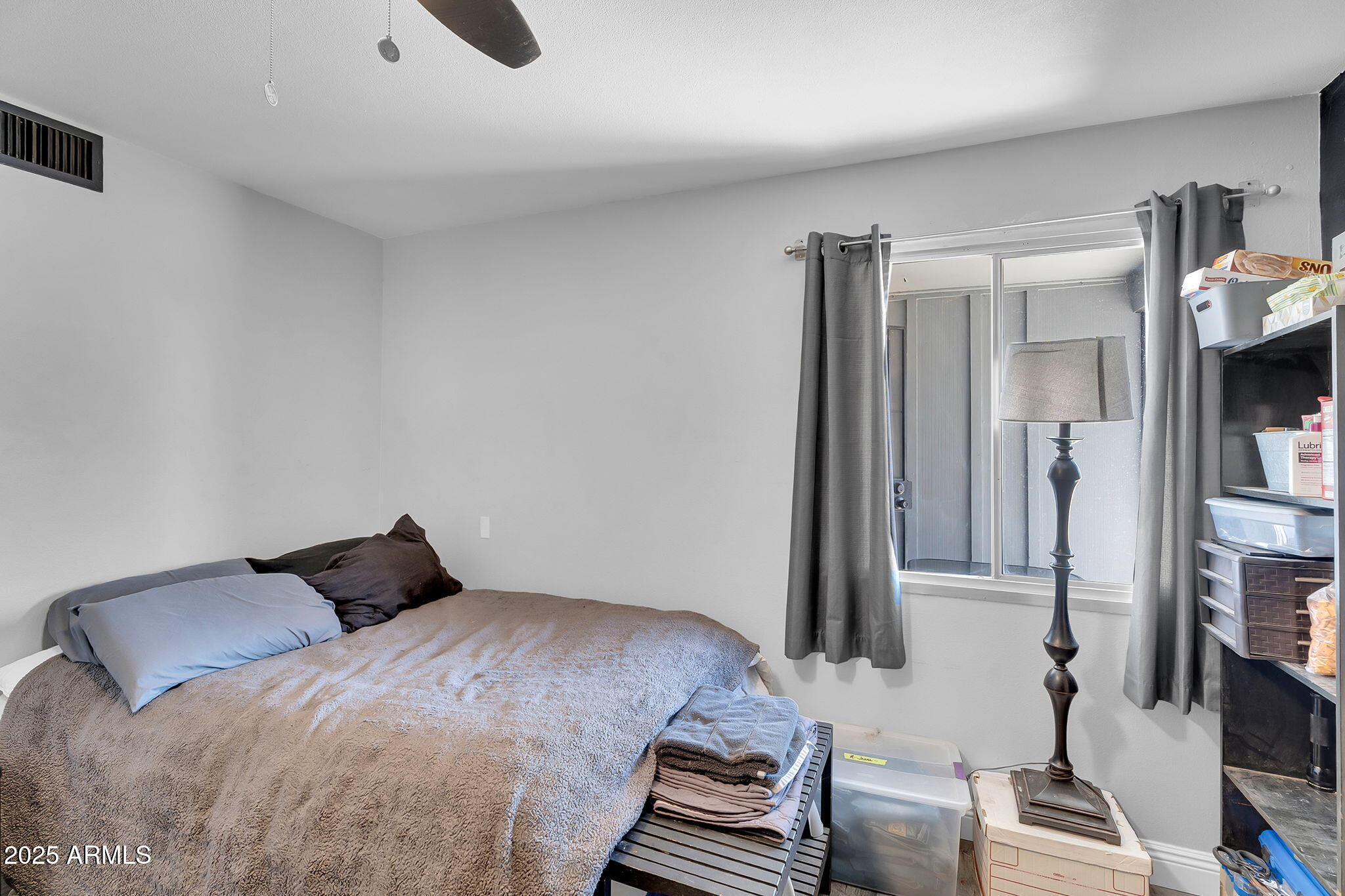 122 East Hermosa Drive Tempe, AZ 85282 - Photo 14 of 30 a bedroom with a bed and wooden floor