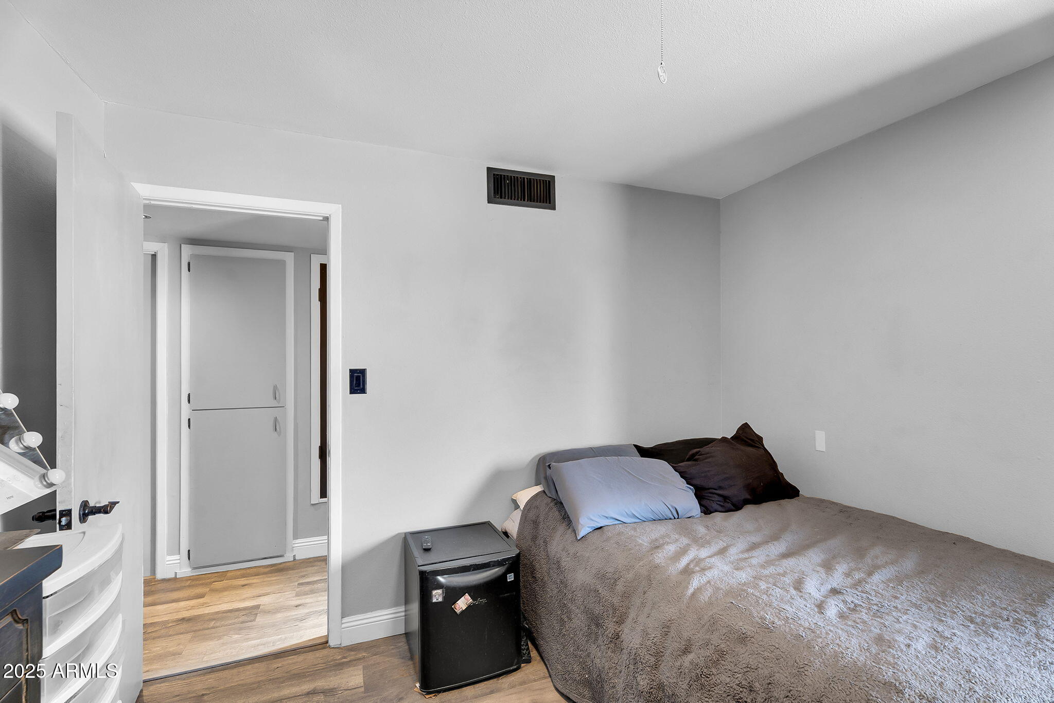 122 East Hermosa Drive Tempe, AZ 85282 - Photo 15 of 30 a bedroom with a bed and wooden floor