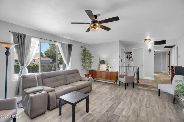 a living room with furniture and a large window