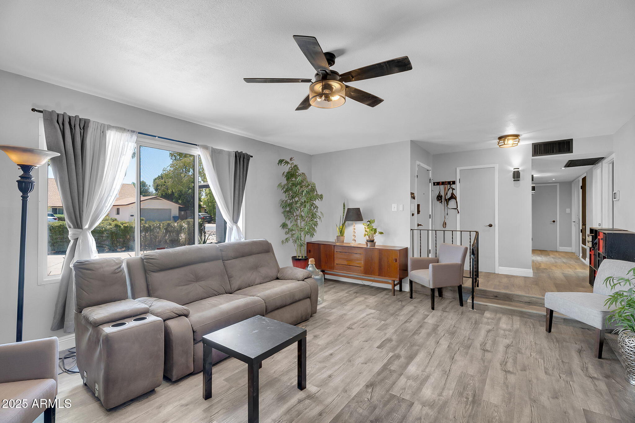 122 East Hermosa Drive Tempe, AZ 85282 - Photo 2 of 30 a living room with furniture and a large window