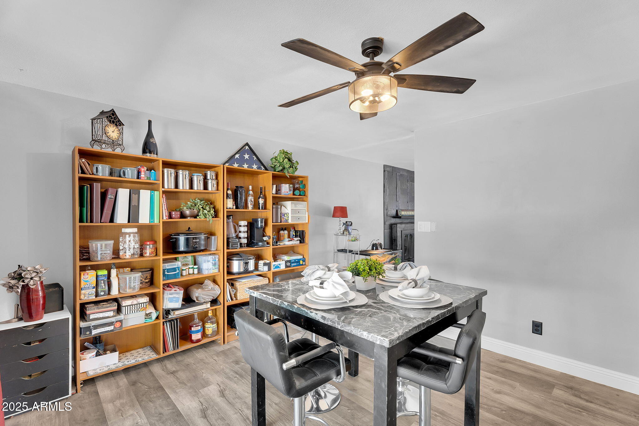 122 East Hermosa Drive Tempe, AZ 85282 - Photo 6 of 30 a workspace with furniture and a book shelf