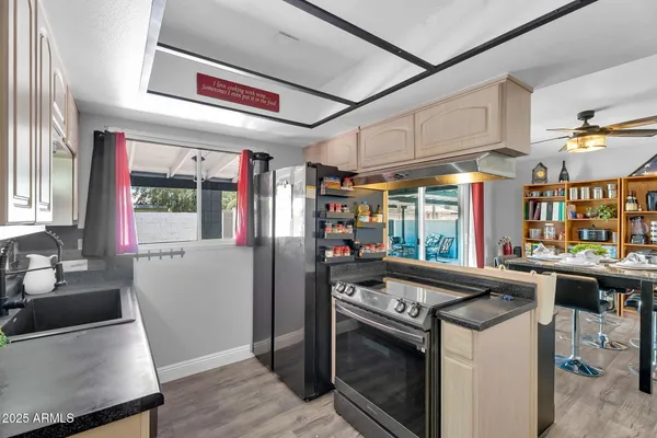 a kitchen that has a stove and a table