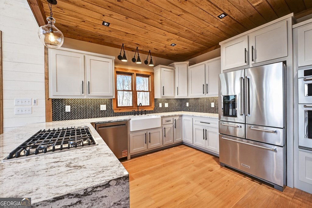 21 Mountain Trace Cherry Log, GA 30522 - Photo 14 of 49 a kitchen with white cabinets and appliances