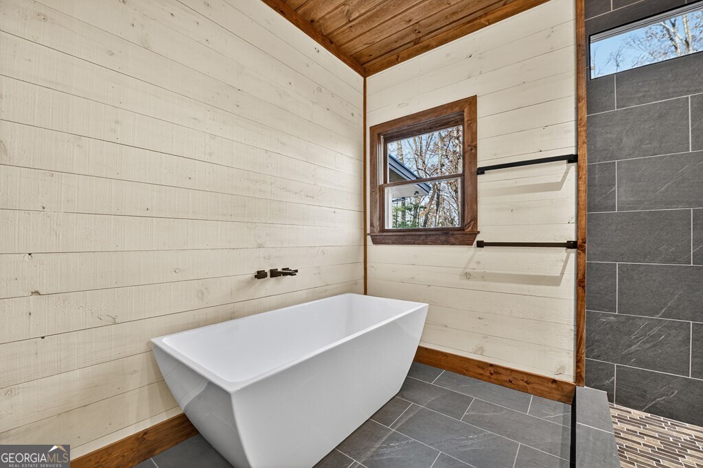 21 Mountain Trace Cherry Log, GA 30522 - Photo 24 of 49 a bathroom with a bathtub and shower