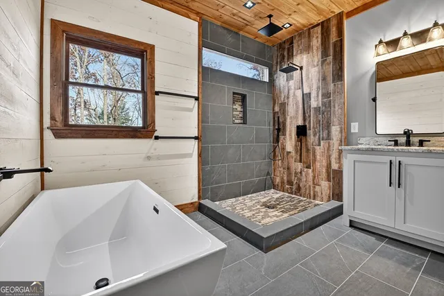 a view of a porch with wooden floor and furniture