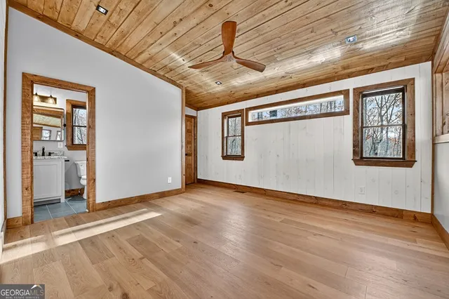 a view of an entryway with wooden floor