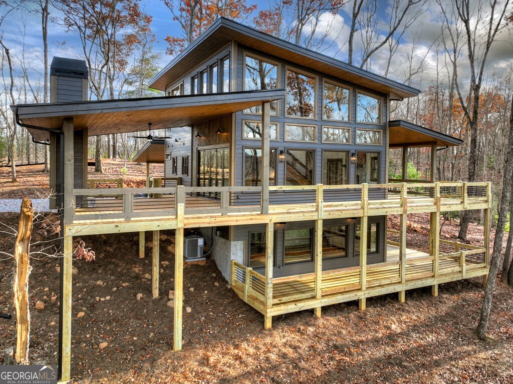21 Mountain Trace Cherry Log, GA 30522 - Photo 3 of 49 a view of house with a large window and wooden fence