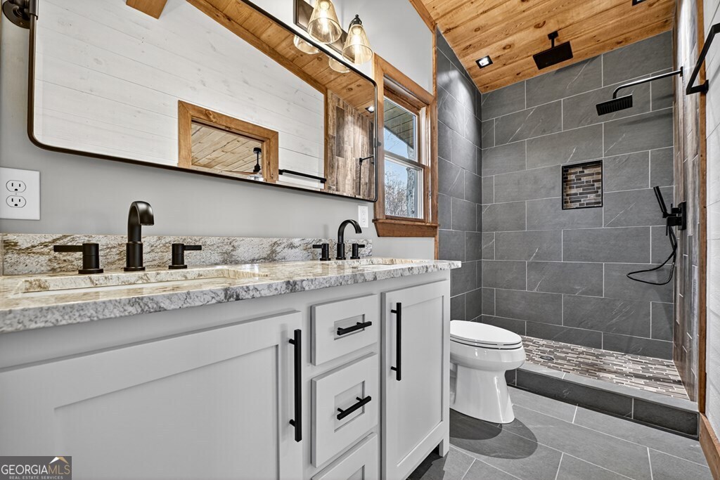 21 Mountain Trace Cherry Log, GA 30522 - Photo 33 of 49 a bathroom with a granite countertop sink toilet and shower