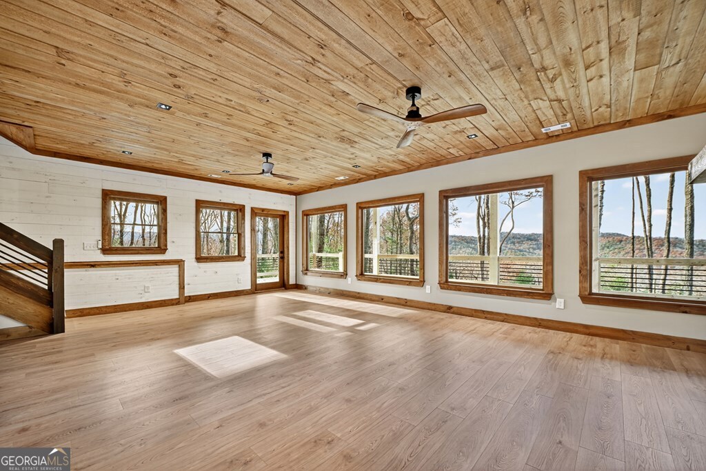 21 Mountain Trace Cherry Log, GA 30522 - Photo 36 of 49 a view of an empty room with wooden floor and a window