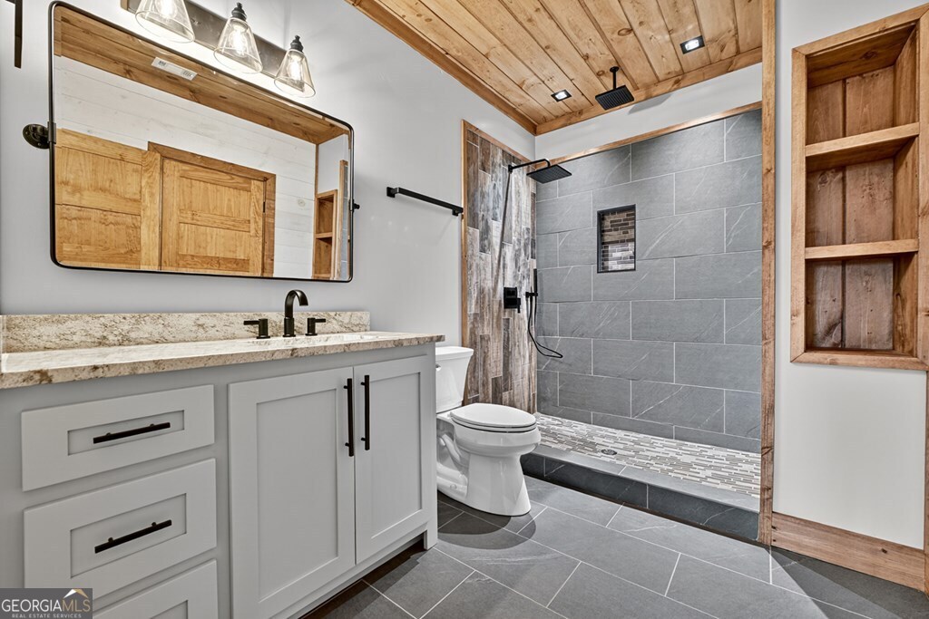 21 Mountain Trace Cherry Log, GA 30522 - Photo 42 of 49 a bathroom with a double vanity sink a toilet and shower
