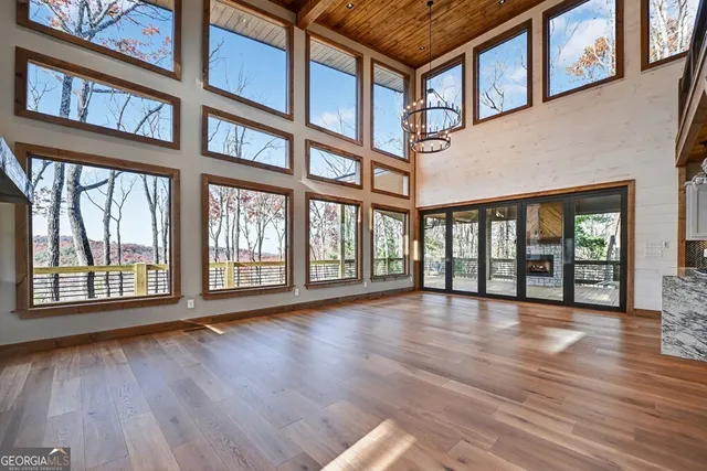 a view of an entryway with wooden floor and a fire pit