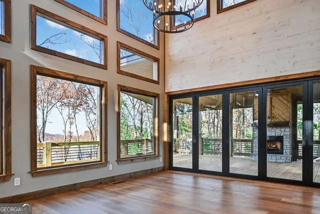 a view of an entryway with wooden floor and door