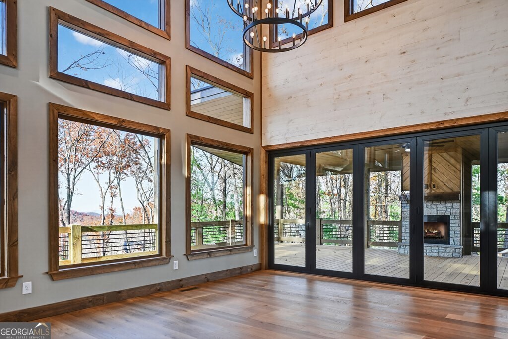 21 Mountain Trace Cherry Log, GA 30522 - Photo 6 of 49 a view of an empty room with wooden floor and a window