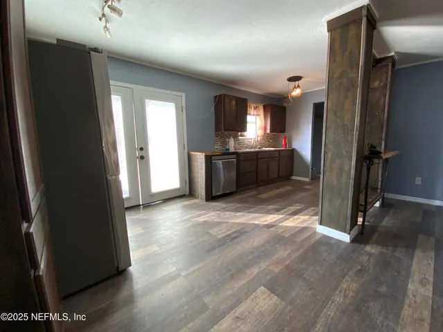 a view of an empty room with a window