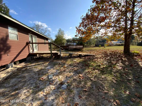 a backyard of a house with lots of green space