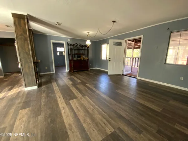 a view of livingroom with hardwood floor and a ceiling fan