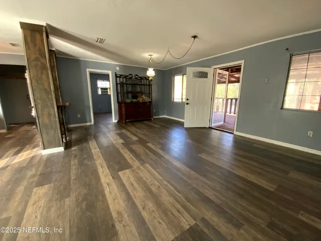 a view of livingroom with hardwood floor and a ceiling fan