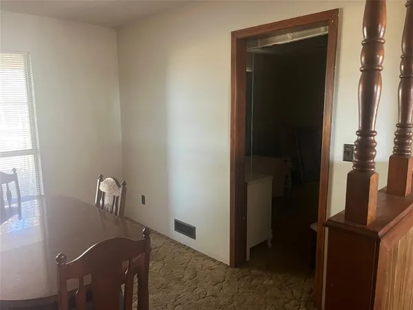 a living room with couches and flat screen tv