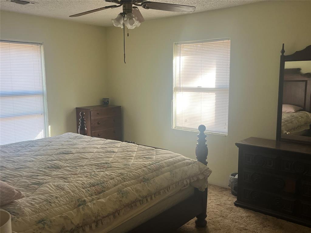 754 Stone Haven Road Idabel, OK 74745 - Photo 8 of 13 a bedroom with a bed and a window