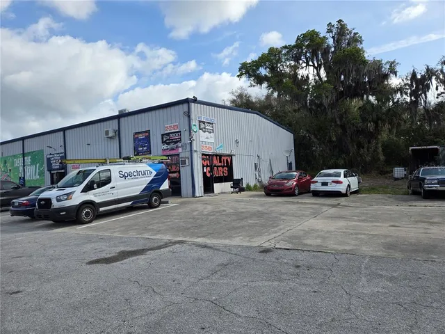 a view of car parked in front of a house
