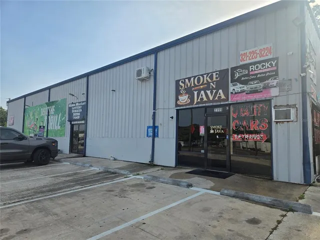 a view of a shop in a street