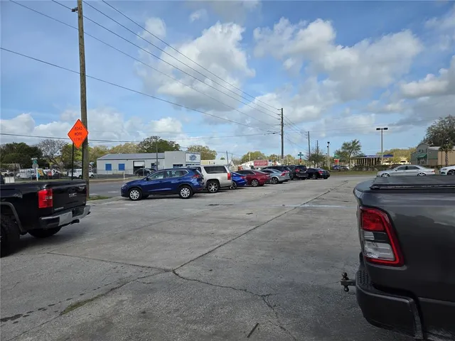 a view of car parked on the roadside