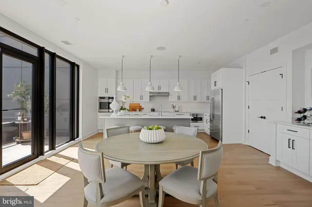 a kitchen with refrigerator a sink and cabinets